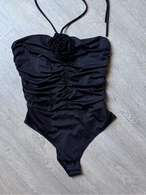 Black Ruched One-Piece Swimsuit with Floral Accent